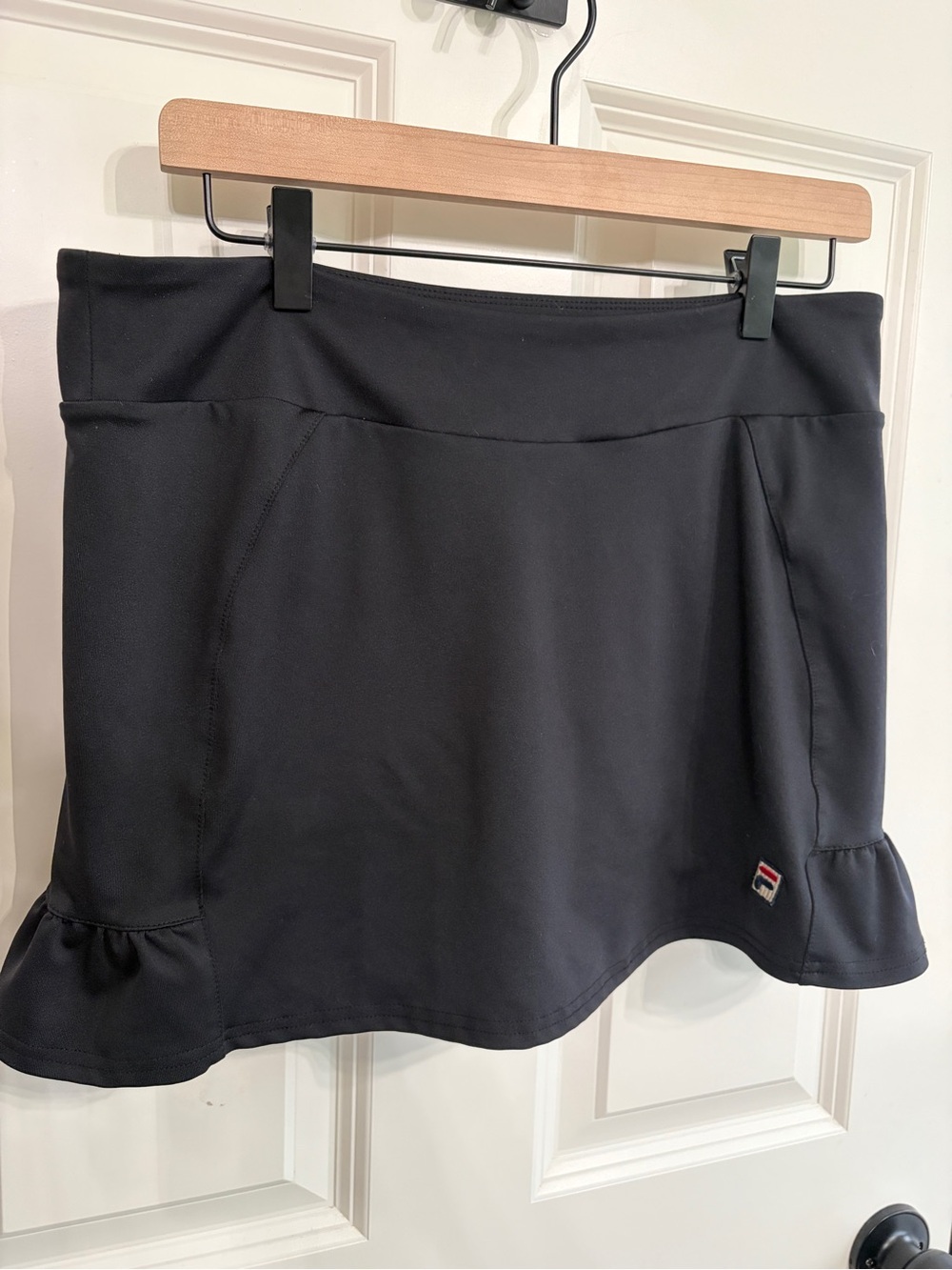 Great condition size M Fila Black skort with ruffles. Flattering and fun.